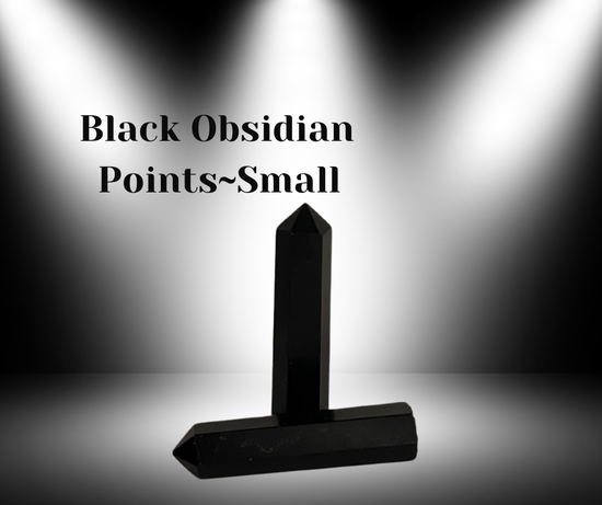 A polished Black Obsidian point carved from natural volcanic glass, known for its grounding, protective, and truth‑revealing energy.