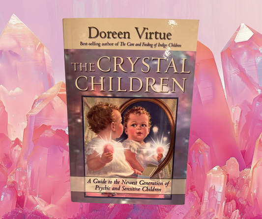 Book titled 'The Crystal Children' by Doreen Virtue with crystal imagery on a pink background